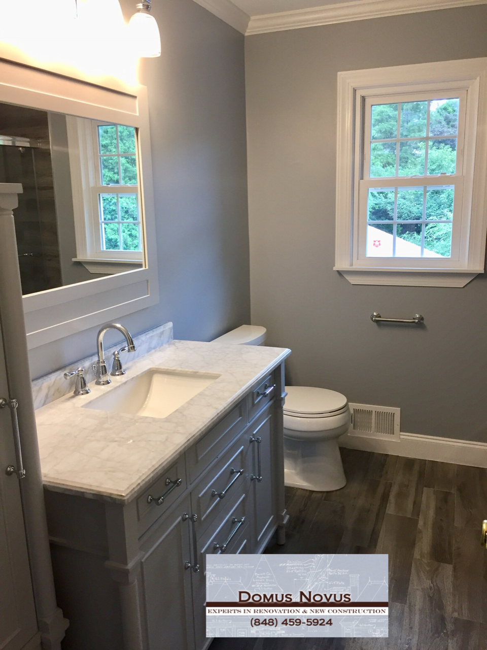 Bathroom, Sink, Toilet, Mirror, Winodw, Door, Floor, Shower, Shower Light, After Remodeling A Bathroom. Work done by General Contractors of Domus Novus LLC. Mydomusnovus projects. Experts in renovations and new constructions.
